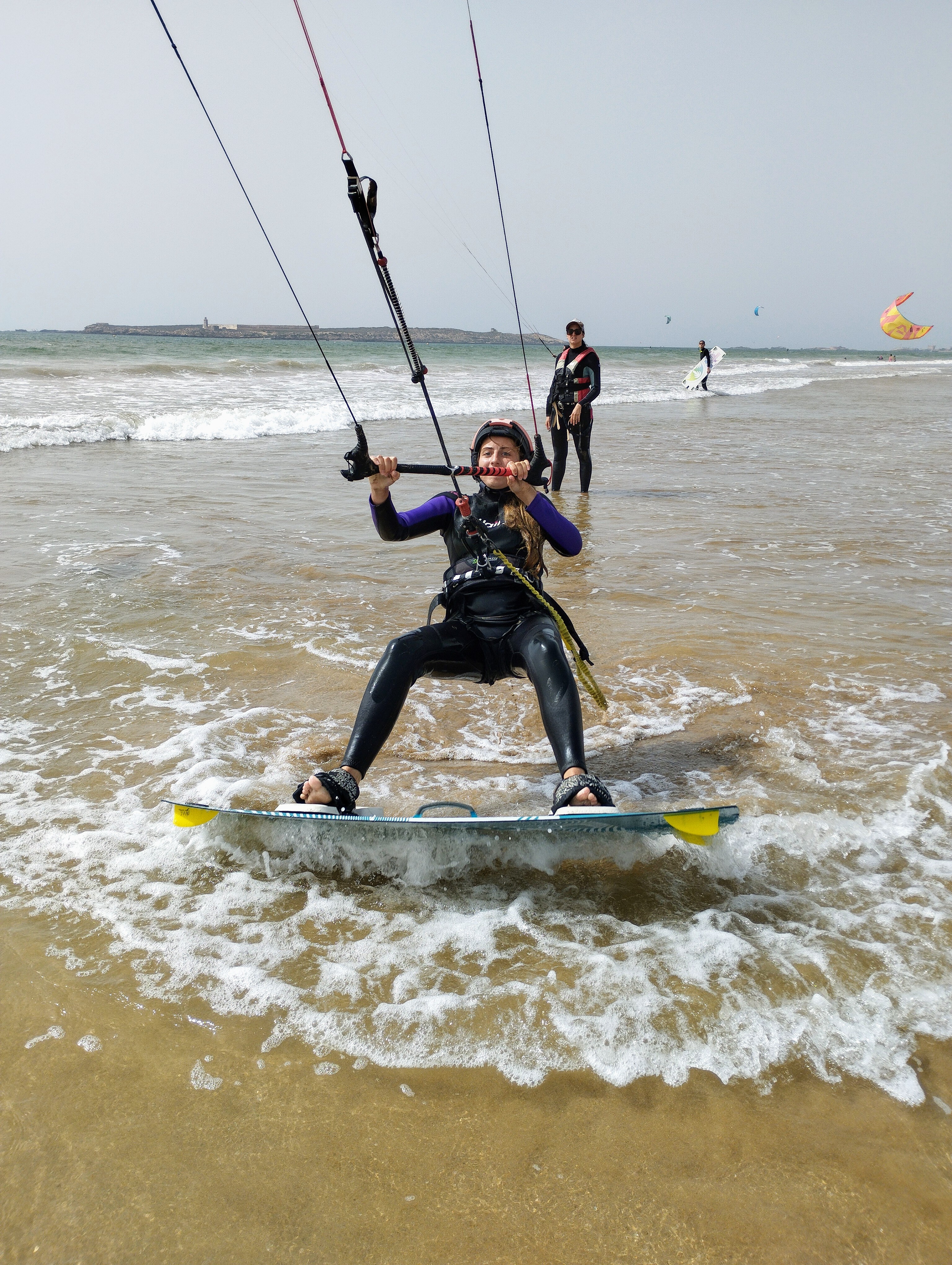 Student riding in the shallows during a lesson