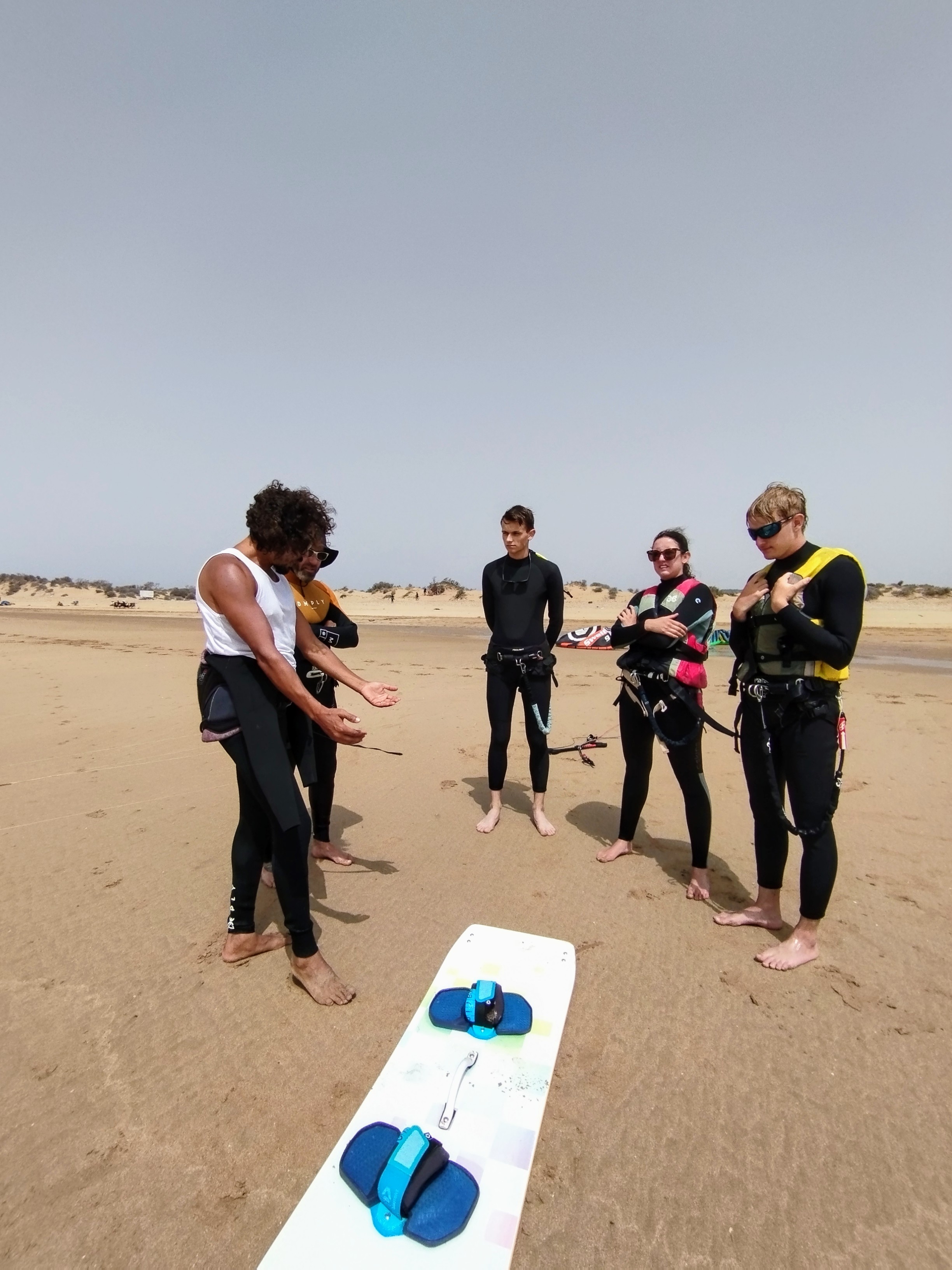 Group lesson briefing on the sand